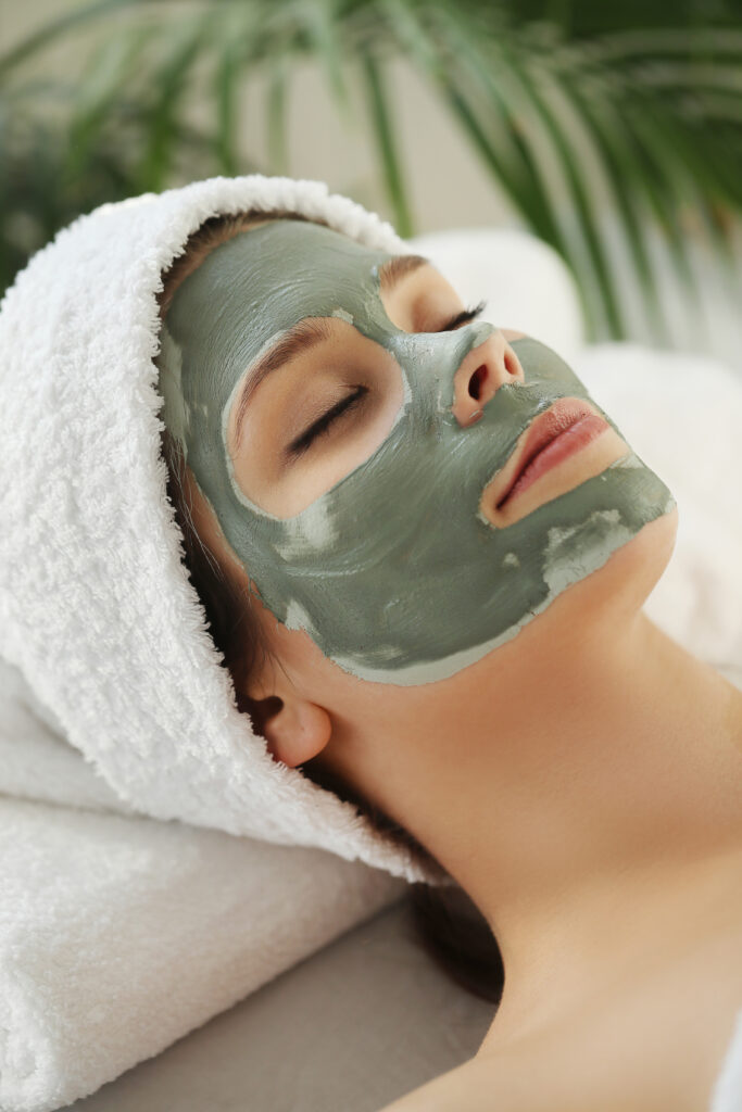 woman receiving beauty treatment skin care
